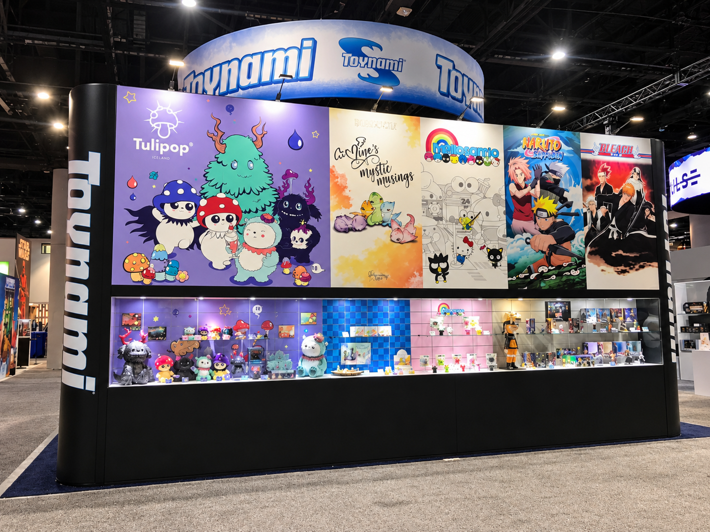 Booth wall with several illustrated graphic panels above display cases