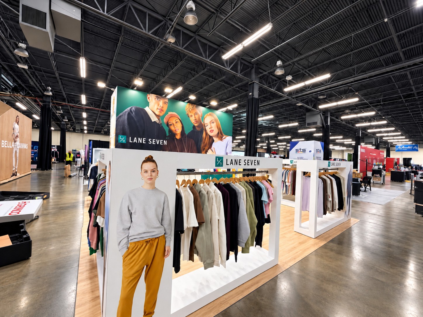 wide view of the Lane Seven island on the show floor with the teal model wall