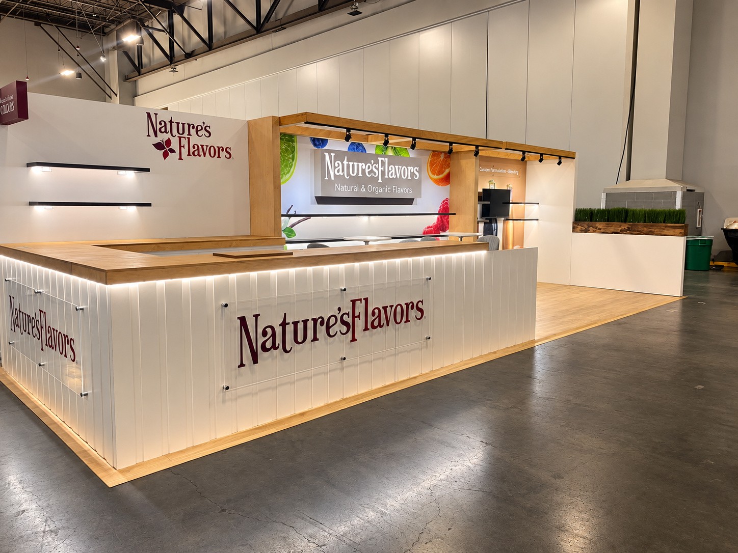 the Nature's Flavors inline counter with jars and bottles on two shelves behind it