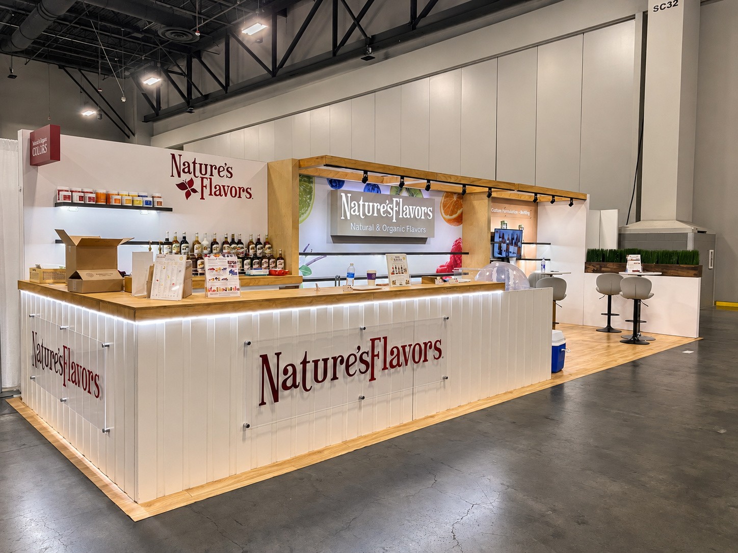 samples and brochures on the counter with stools at the right end